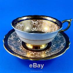 Rich Gold with Cobalt Trim and Floral Center Paragon Tea Cup and Saucer Set