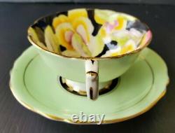 VINTAGE PARAGON Pansy on Black with Green Surrounding Teacup and Saucer Set